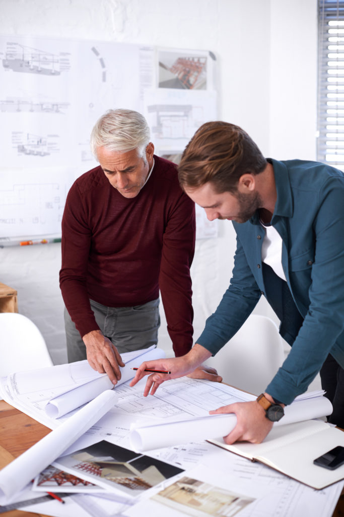 Cropped shot of two male architects working together in their office.
